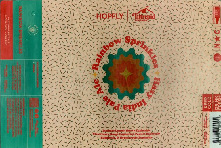 Rainbow Sprinkles beer label from Hopfly: A central gear-shaped emblem with a starburst center surrounded by red lettering reading 'Rainbow Sprinkles Hazy India Pale Ale' on a beige background patterned with small black dashes.