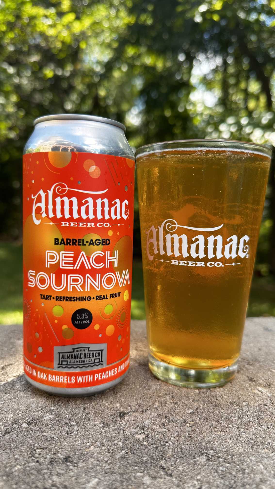 Almanac Peach Sournova can with a glass