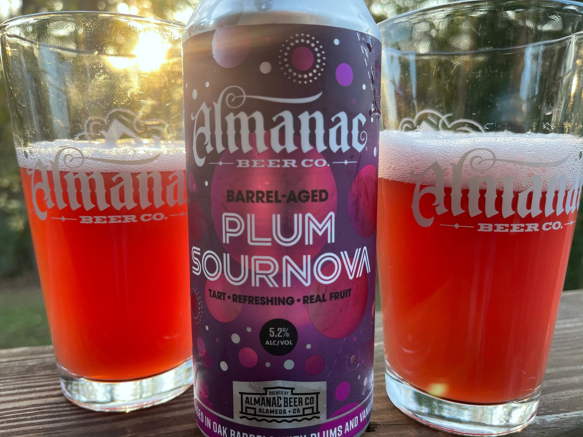 Almanac Plum Sournova can with two glasses