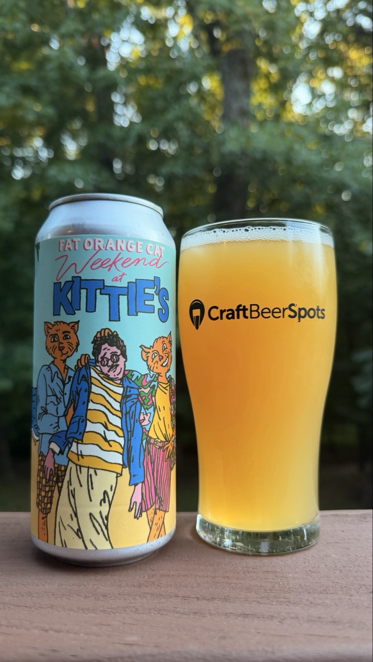 CraftBeerSpots photo of Fat Orange Cat Weekend At Kittie's can beside a glass of pineapple IPA
