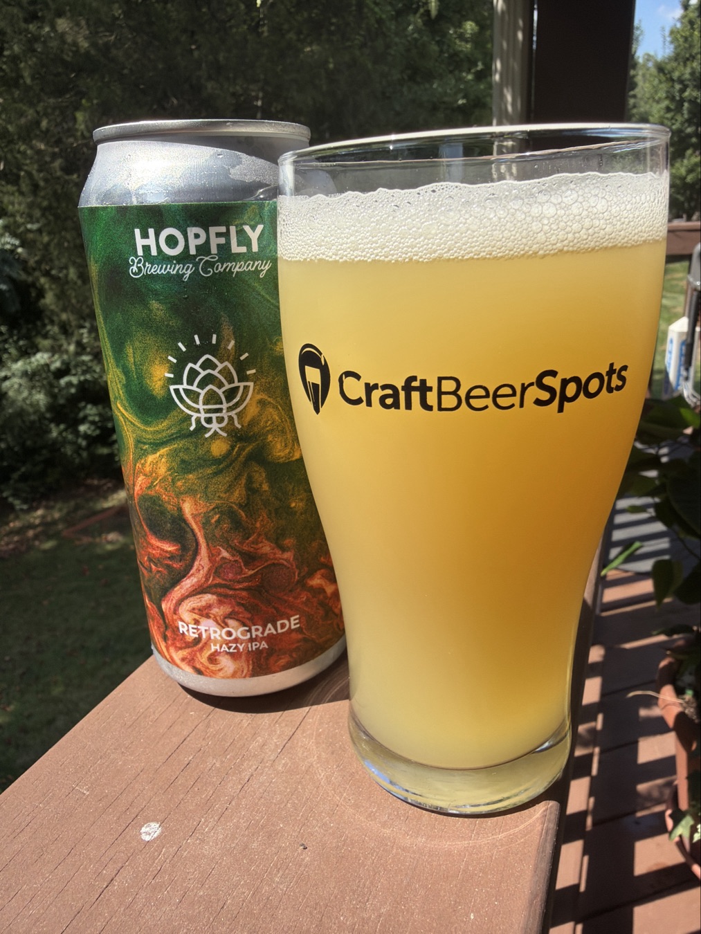HopFly Retrograde can beside a hazy beer photographed by CraftBeerSpots